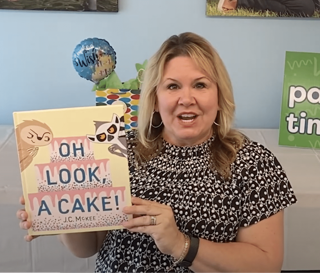 OH LOOK, A CAKE! Written by J.C. McKee, read by Miss Lisa. A subversively hilarious picture book about a sloth, a lemur, a giant cake, and what happens when you don't share